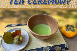 Japanese bowl of green tea with plate of sweets