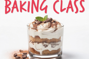 tiramisu in a clear glass with layers of cake and cream