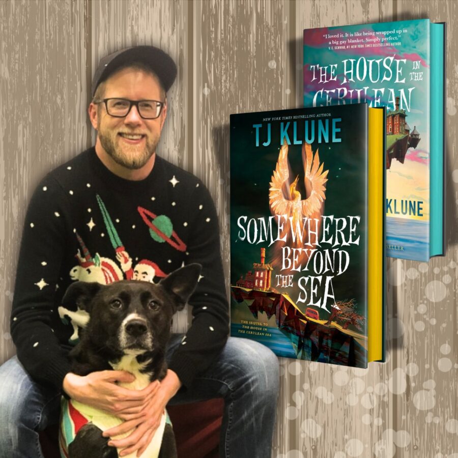 author sitting with his dog and next to cover sof his book