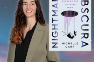 author with book with a night sky in the background