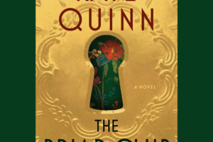 brass intricate dore plat for a key with flower wall paper seen through keyhole