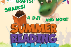 child sitting on large block letters reading a book wit a dinosaur reading over his shoulder and wearing a party hat